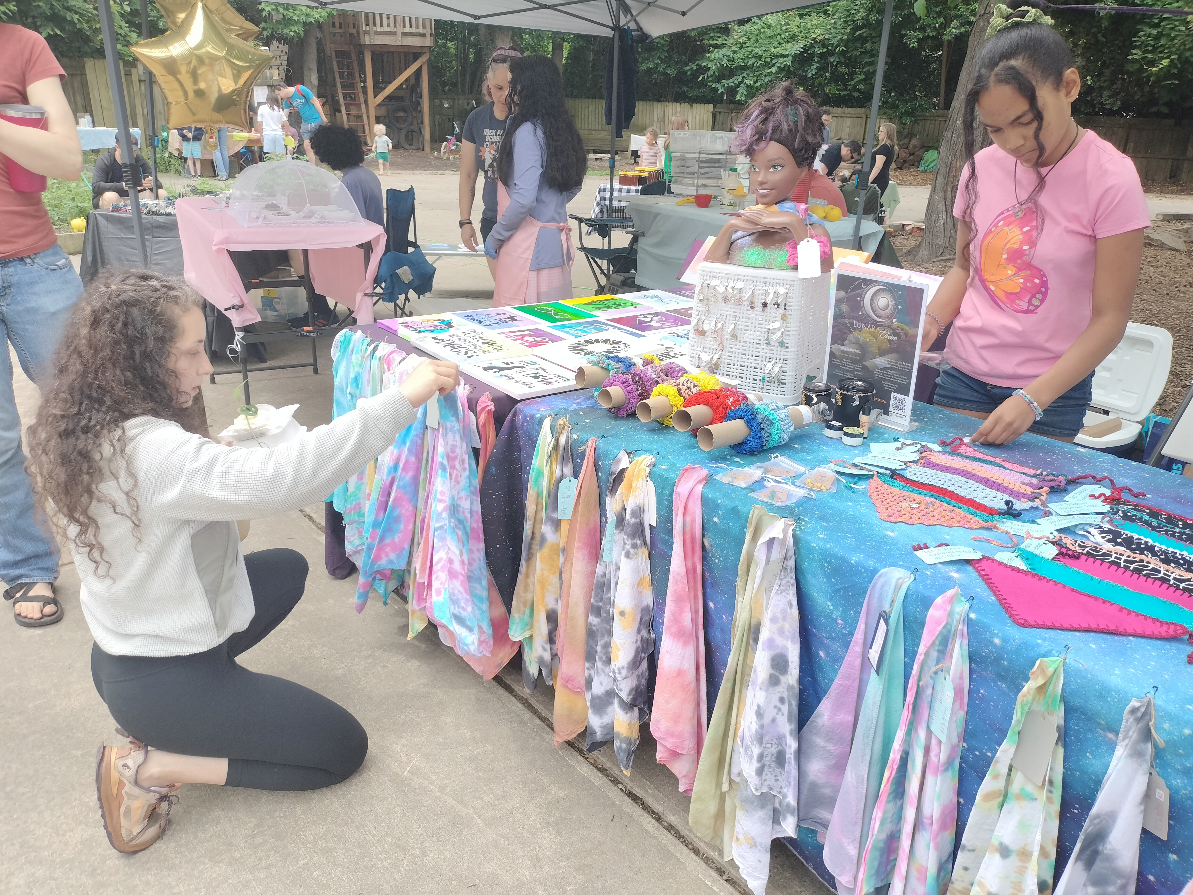 Maya organizing neighborhood art fair